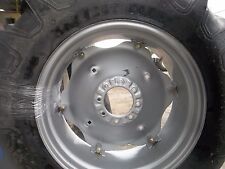 Two 13.6x28 R1 Tractor Tires On 6 Loop Wheels Painted Silver With Centers